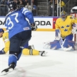 COLOGNE, GERMANY - MAY 20: Sweden's Henrik Lundqvist #35 makes a save against Finland's Mika Pyorala #37 while his teammate Alexander Edler #24 looks on during semifinal round action at the 2017 IIHF Ice Hockey World Championship. (Photo by Matt Zambonin/HHOF-IIHF Images)

